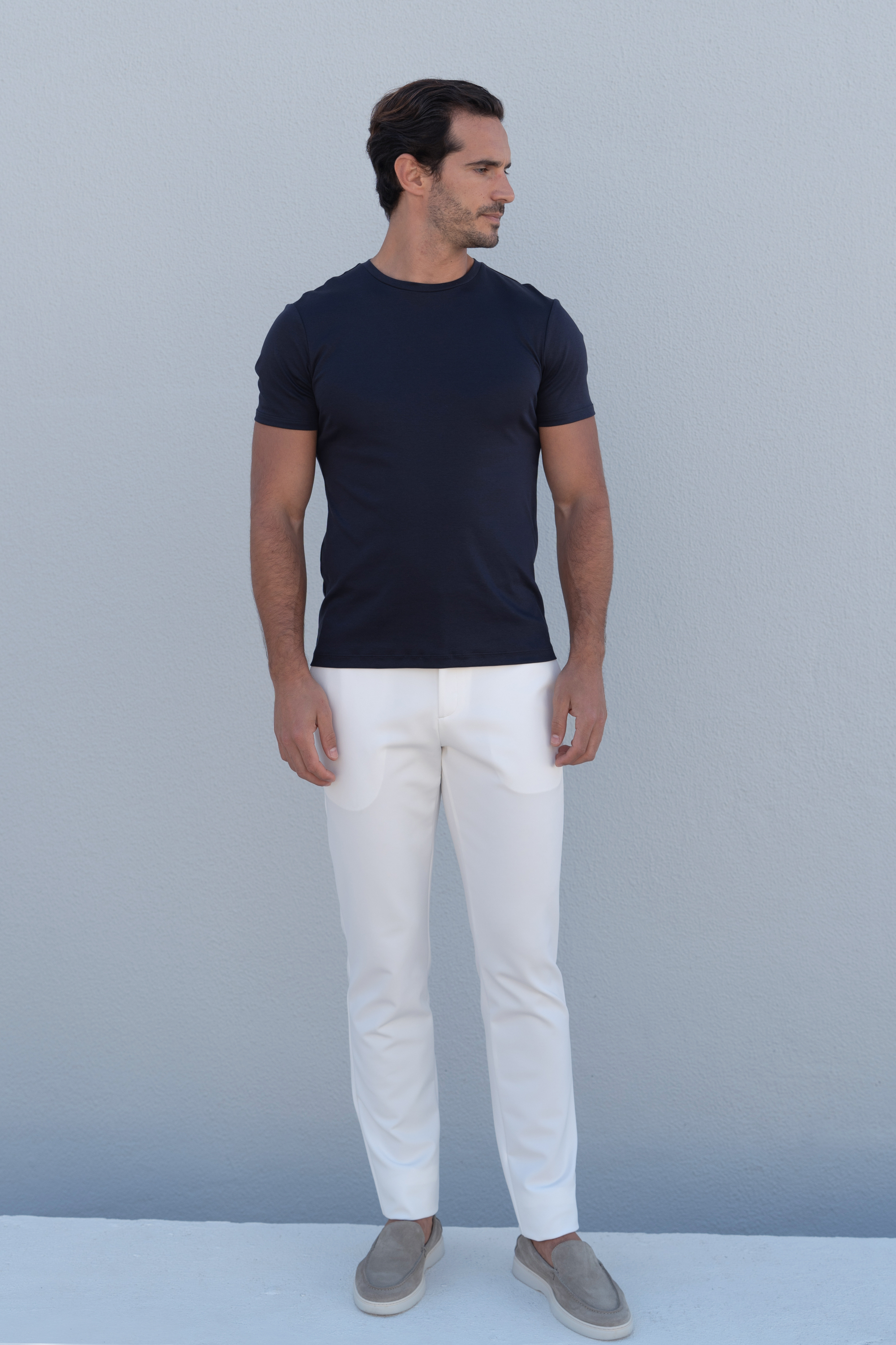 Elegant white casual trousers featuring essential luxury and refined styling.