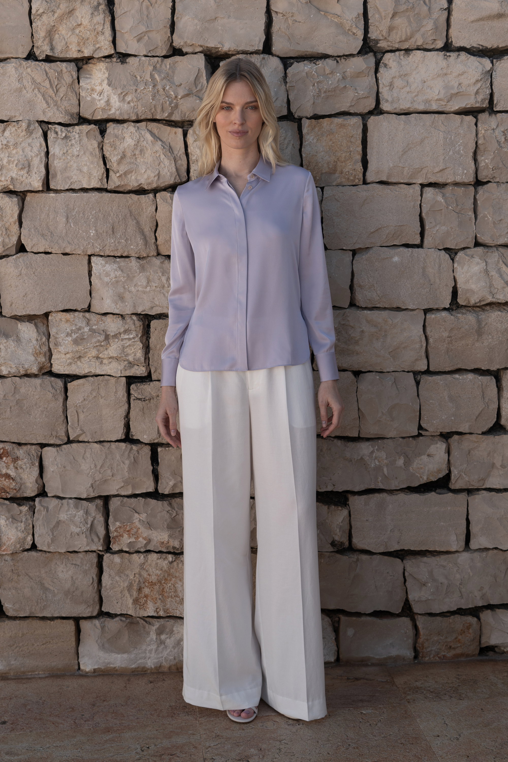 Essential light purple silk blouse with concealed placket embodying luxury and refined elegance