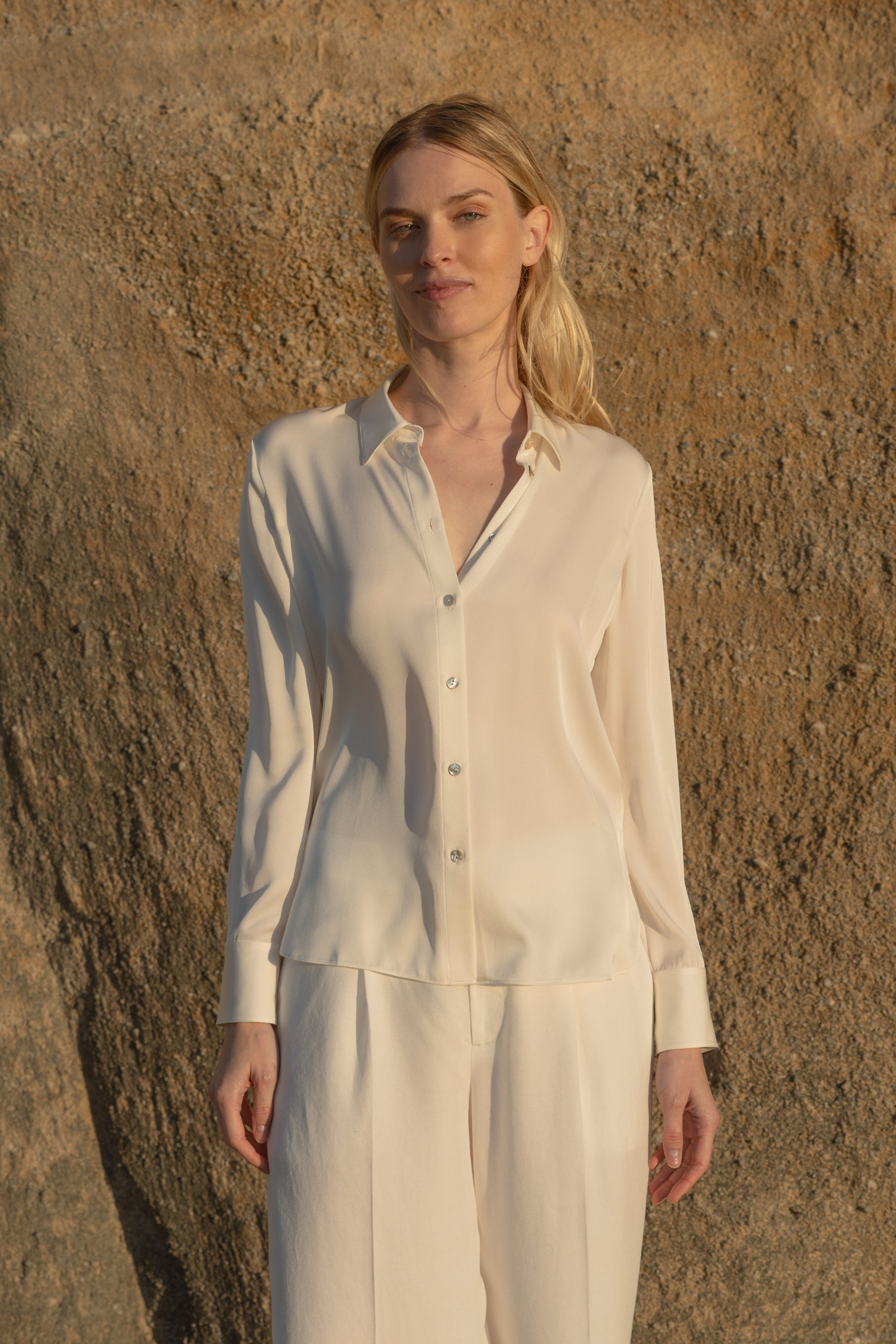 Timeless offwhite silk blouse displaying quality craftsmanship and elegant finishing.